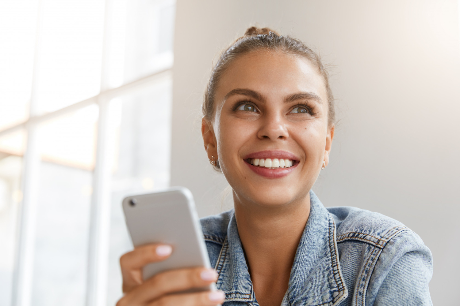 Woman smiling with cell phone